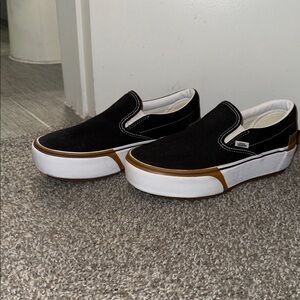 Vans Black and White Slip-On Shoes with Gold Trim and thick heel women’s 8